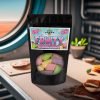Fruity-Fractals-2A Spaced Out Snacks - Fruity Fractals freeze dried candy Family Size bag sitting on a table in a spaceship looking out on a distant planet.