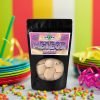 Meteor-Melts-2 Spaced Out Snacks - Meteor Melts freeze dried candy sitting on a table at a festive party.