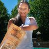 B0DWMHH549.PT03 Oh My Gourd Becky, Look At The Size of Her Pumpkin! gourmet pumpkin spice kettle corn Family size bag, pool lifestyle view.